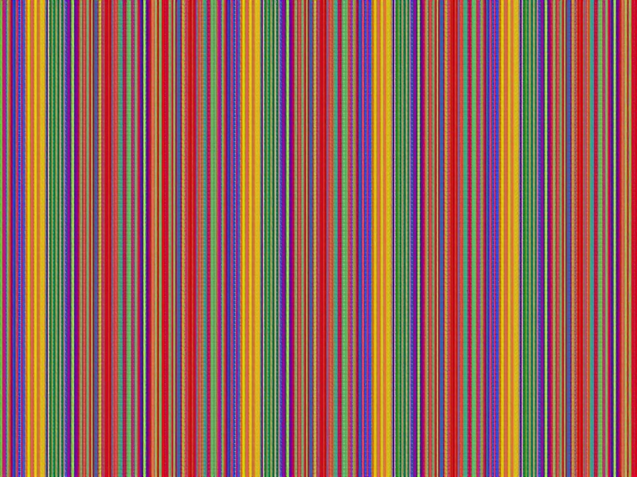 The image consists of numerous vertical stripes in various colors. The colors include red, blue, green, yellow, purple, orange, and many more. The stripes are arranged in an alternating pattern, creating a vibrant and colorful effect. Each stripe has a consistent width, contributing to a rhythmic appearance. The overall composition is visually striking and could be used for decorative purposes or as a colorful background.