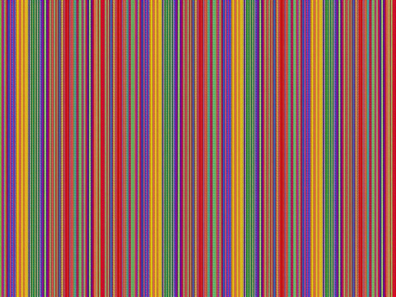 The image consists of numerous vertical stripes in various colors. The colors include red, blue, green, yellow, purple, orange, and many more. The stripes are arranged in an alternating pattern, creating a vibrant and colorful effect. Each stripe has a consistent width, contributing to a rhythmic appearance. The overall composition is visually striking and could be used for decorative purposes or as a colorful background.