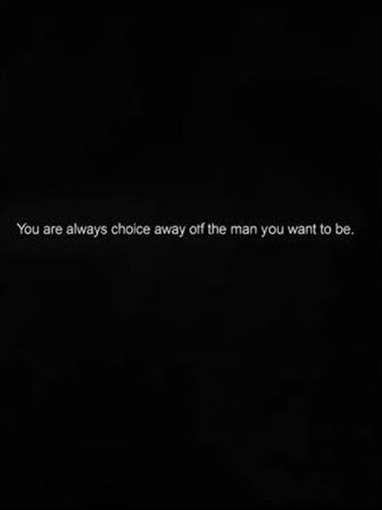 This image displays a motivational quote. The quote reads 'You are always one choice away from the man you want to be.' The text is bold and white against a solid black background. The design is minimalist, emphasizing the quote.