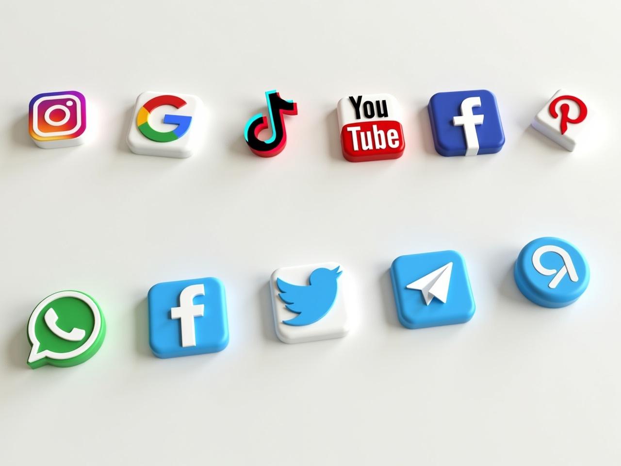 The image displays a collection of popular social media icons arranged in two rows. The first row includes icons for Instagram, Google, YouTube, TikTok, and Facebook, each in distinct colors and styles. The second row contains icons for WhatsApp, Twitter, Messenger, Pinterest, and Telegram. Each icon is three-dimensional with a glossy finish, making them visually appealing. The background is neutral, allowing the icons to stand out clearly. This arrangement showcases various platforms used for social networking and communication.