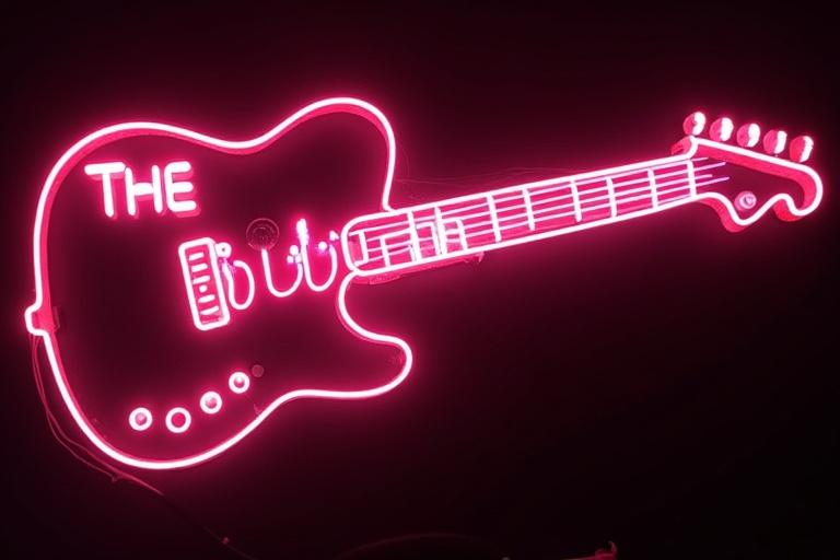 Neon sign shaped like a guitar featuring the words The Chickenns. Bright neon lighting in pink against a black background.
