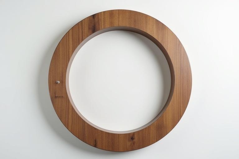 A round wooden frame with an outer diameter of 50 mm and an inner diameter of 10 mm, showcasing a thickness of 10 mm.
