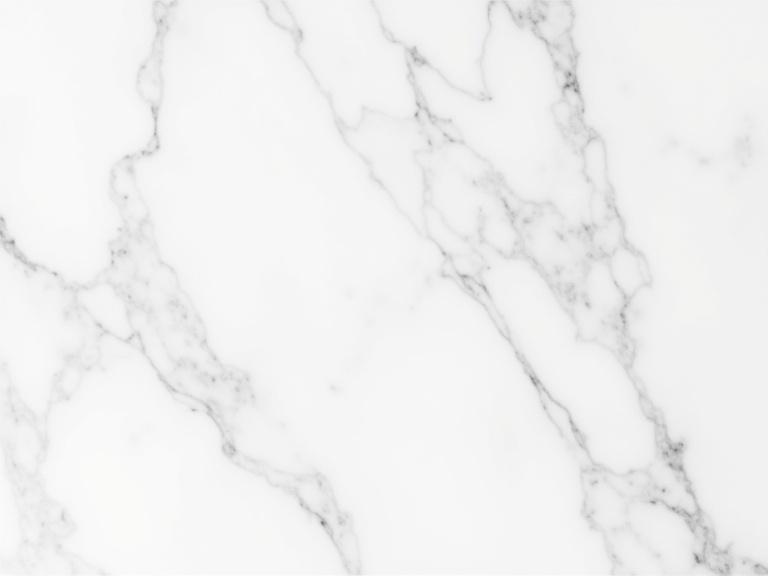 A seamless white marble texture with gray veins running through it. The surface is smooth and polished. It is ideal for backgrounds and surfaces in designs. The overall appearance is clean and modern.