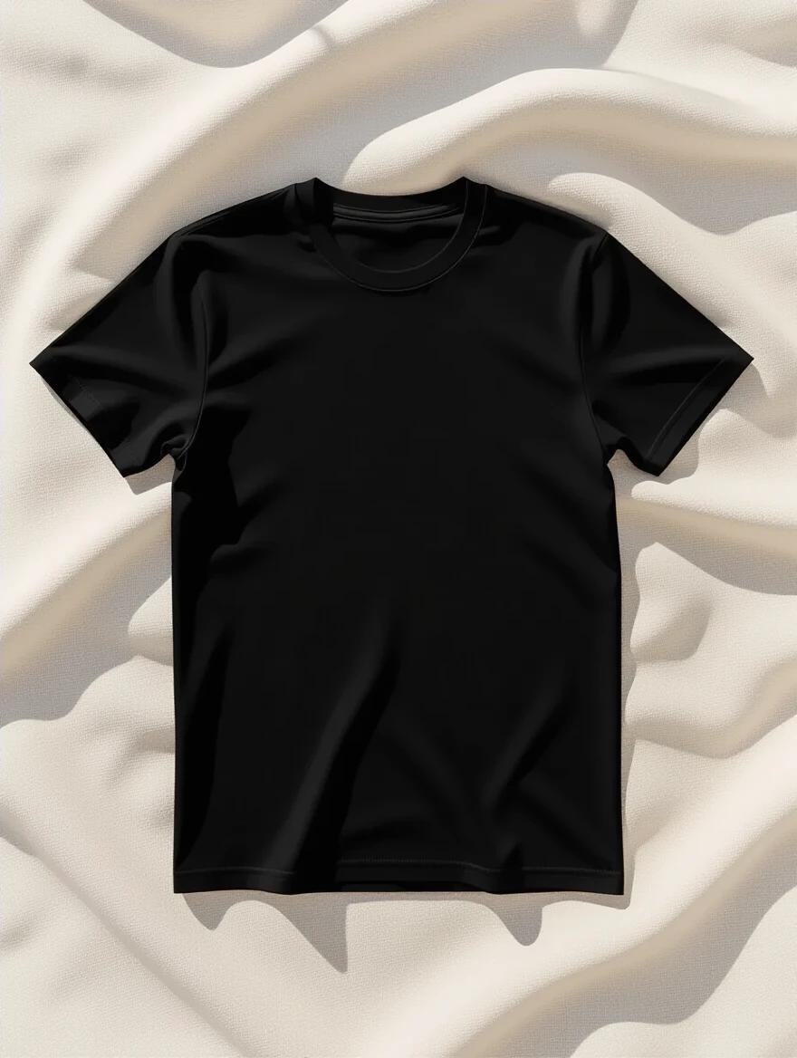 A top-down flatlay mockup of a plain black unisex T-shirt. The T-shirt is lying on a soft linen background. The background is neutral and minimal. The chest area is empty. The shirt has no design. The texture appears realistic. Natural daylight illuminates the scene. There are soft shadows. The shirt shows no wrinkles or folds.