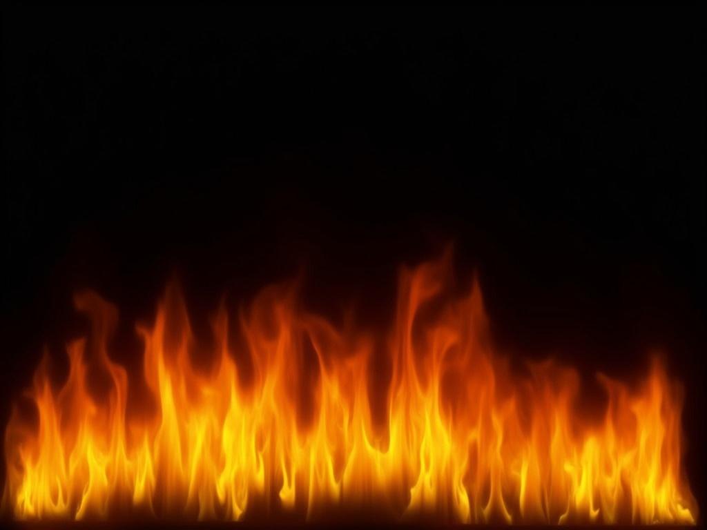 The image features vibrant fire flames against a solid black background. The flames flicker in varying shades of orange, yellow, and red, creating a dynamic and intense visual effect. The arrangement of the fire is such that it forms a fiery wave along the bottom of the image. There are no visible objects or distractions in the background, enhancing the focus on the flames. This creates a dramatic contrast that highlights the energy and movement of the fire.