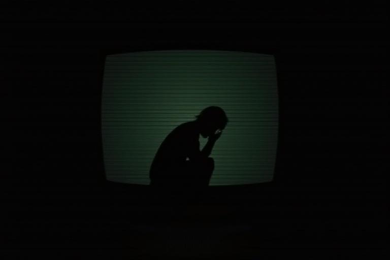 analog horror warning screen black background person icon minimalist design bowing to the floor disturbing VHS glitch effects horizontal scanlines eerie style retro CRT monitor look creepy PSA aesthetic unsettling Surreal liminal atmosphere