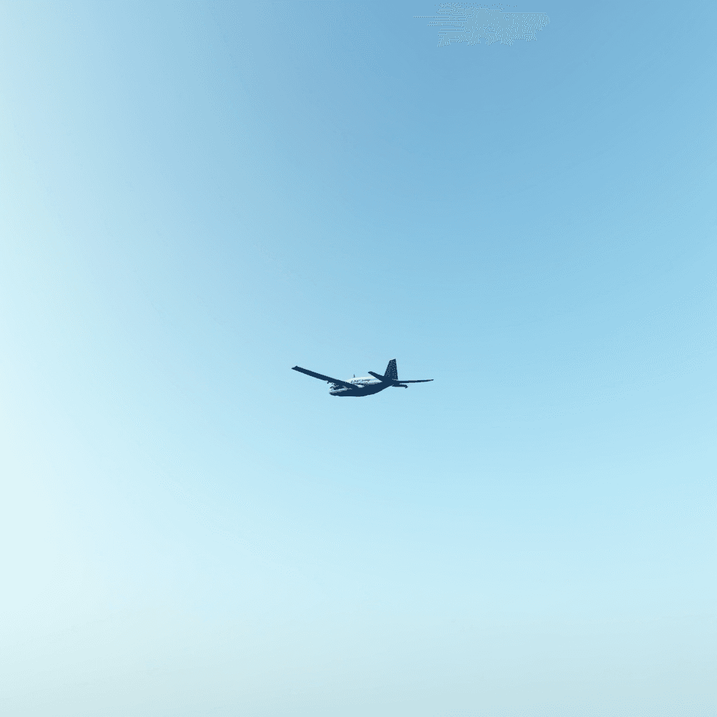 A small propeller airplane glides through a clear blue sky, capturing a serene moment of solitude and flight.