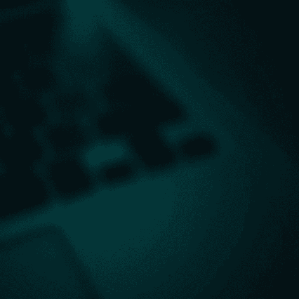 An abstract, blurred representation of a dark keyboard, giving an impression of a digital device.