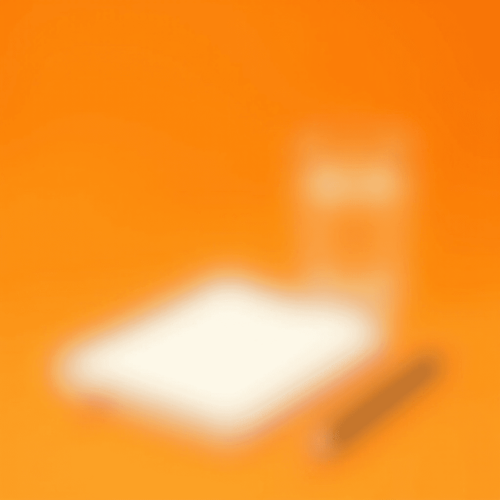 A blurred image showcasing a notebook, pencil, and cup against an orange background.