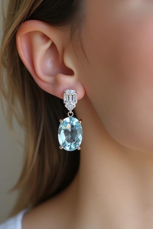 Detailed close-up of aquamarine earrings featuring cushion cut aquamarines. Model showcasing elegant design. Soft focus on jewelry. Natural and elegant presentation.