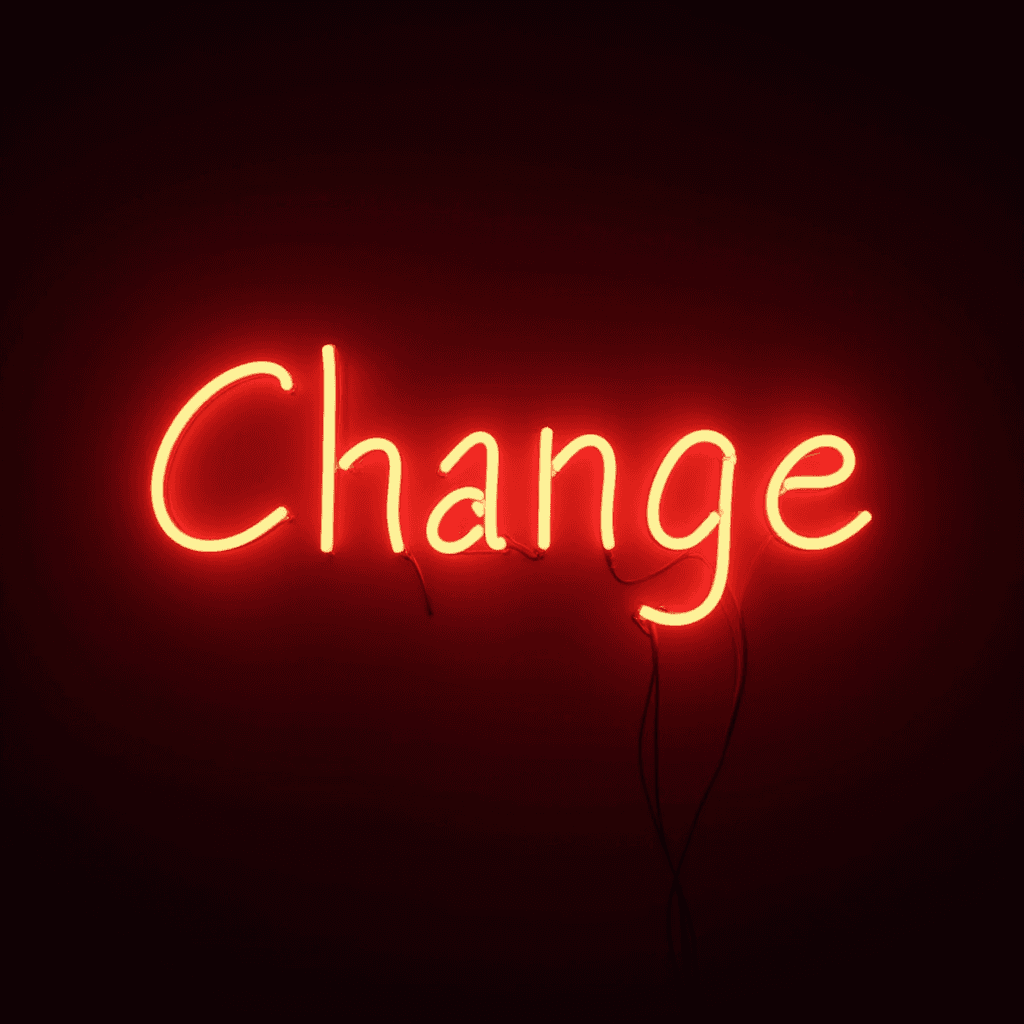 Bright red neon sign displaying the word 'Change'.